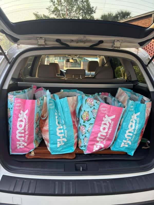 Reusable bags filled for BackPack Buddies delivery in a car trunk